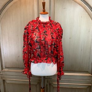 Floral crop top. I think size med. purchased at Buffalo exchange in California.